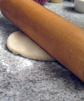 Use a rolling pin on a floured surface to form a disc